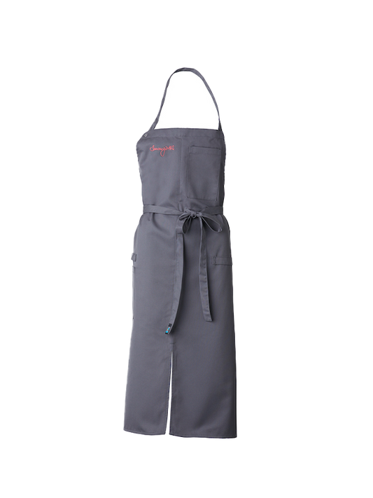 Gray Rittmeyers KOCHSCHÜRZE „SAUCENGÖTTIN“ mit Fronttasche, Taillenbändern und rotem Logo auf der oberen Brust.